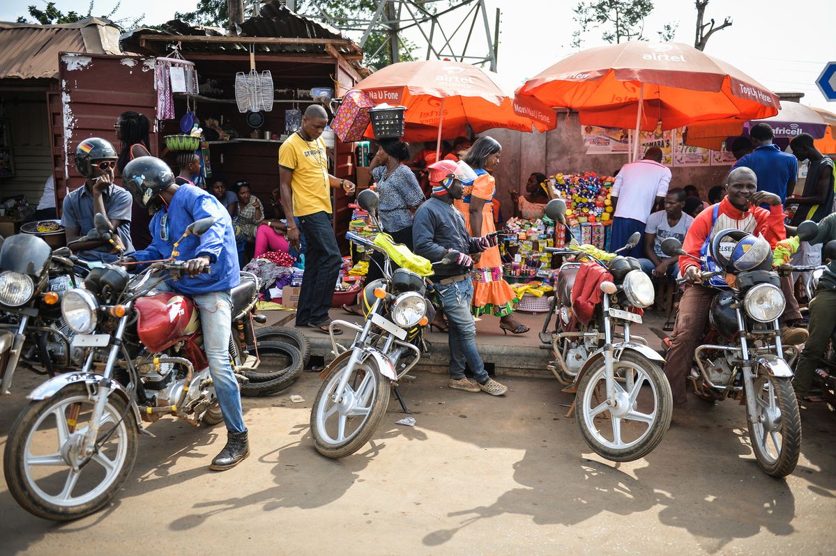 Motorbike rider in an African city street